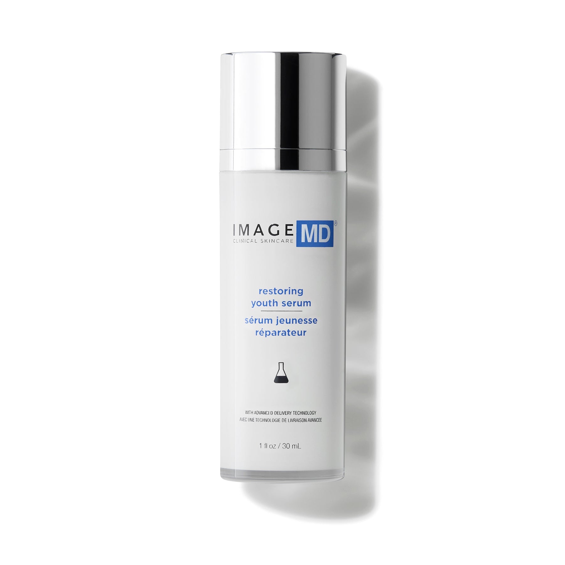 Bottle of IMAGE md restoring youth serum on white background
