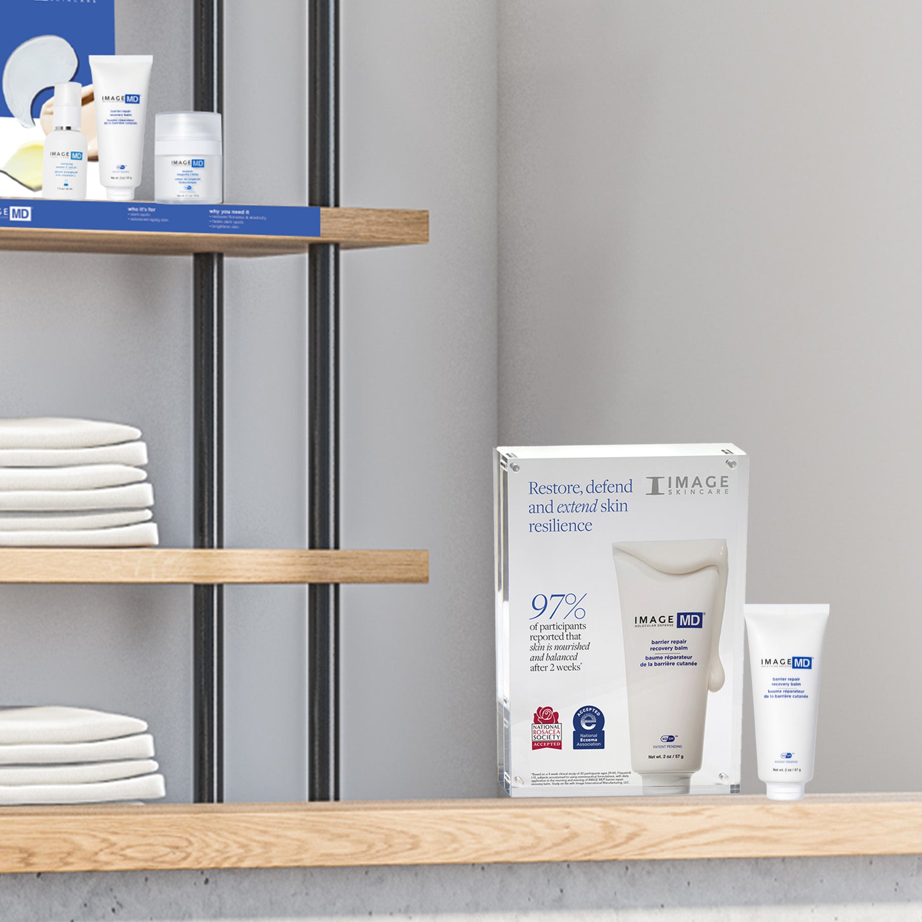 Cosmetic products on a shelf with a neutral background