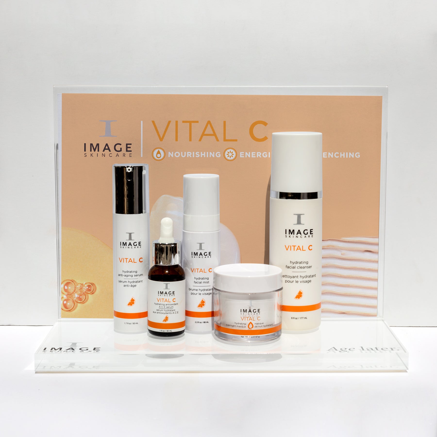 full VITAL C collection products on acrylic display stand with VITAL C flyer inside display