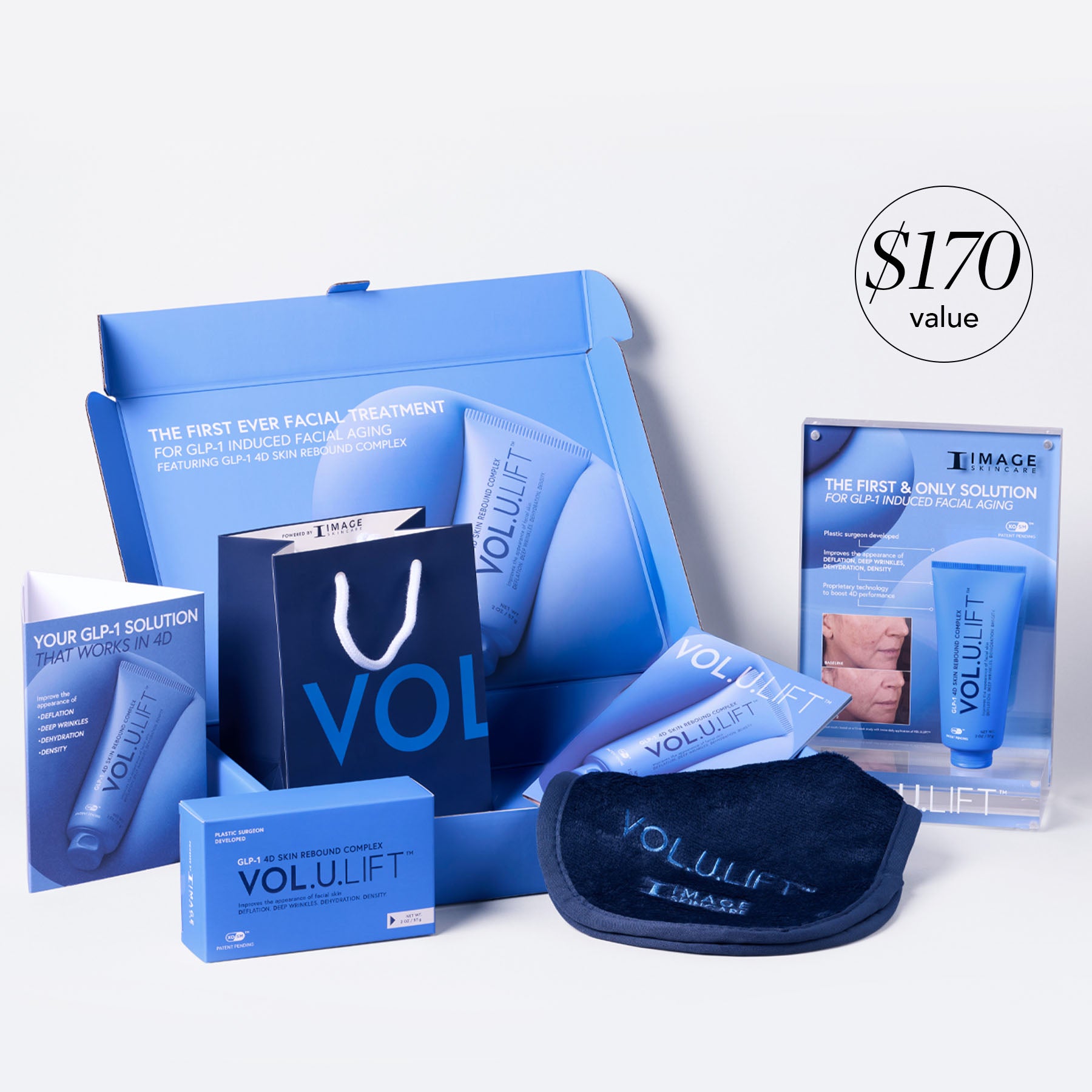 VOLULIFT skincare product set with packaging and accessories on a white background
