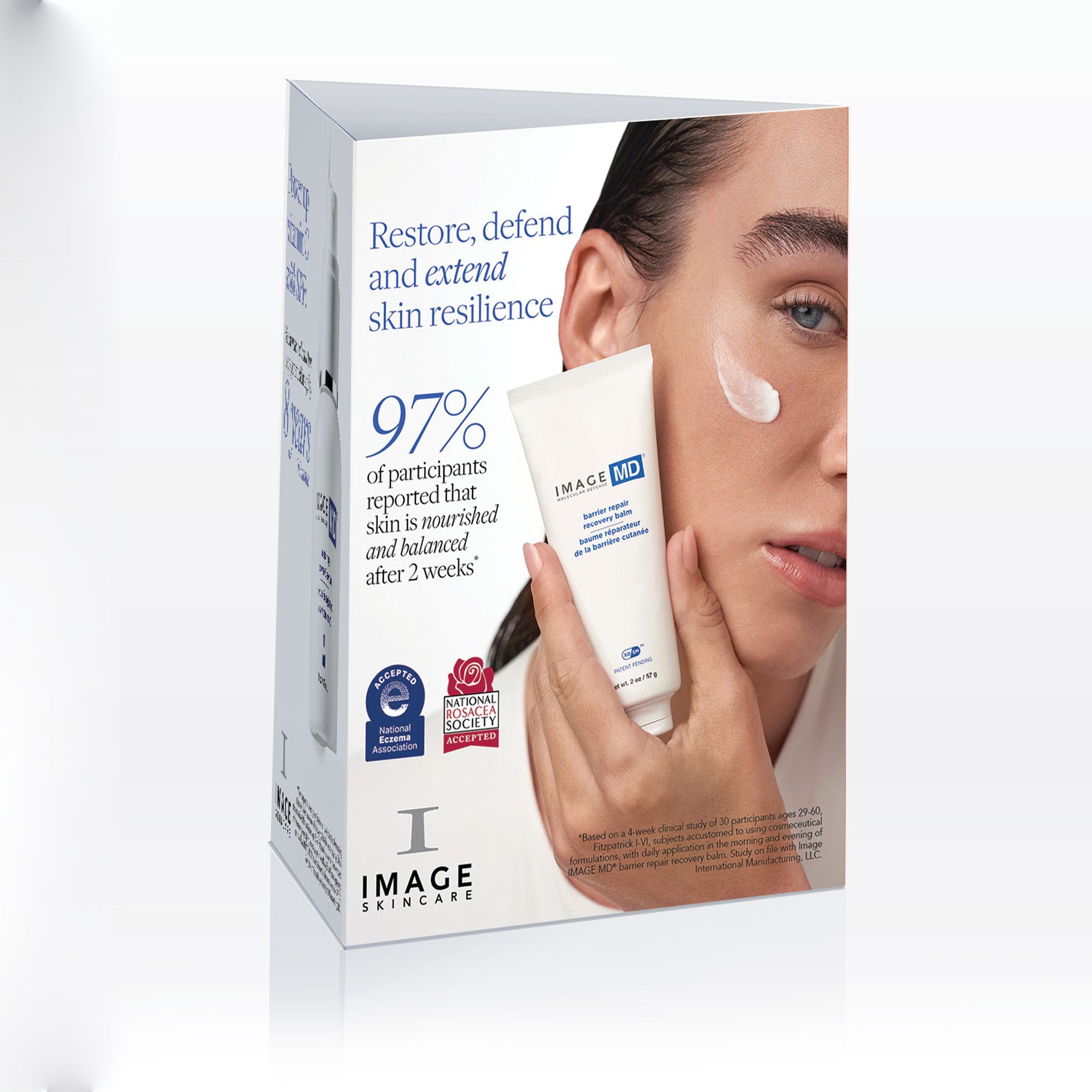 IMAGE Skincare product packaging with a woman applying cream to her face.